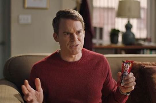 Michael C. Hall holding a sweet bag of Skittles. Used with permission from Skittles.
